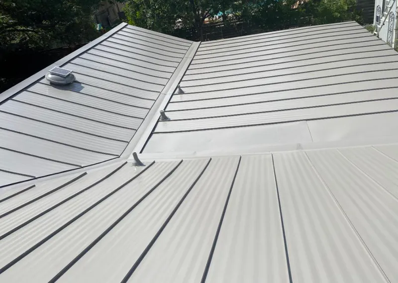 Solar attic fan installed on a metal roof for Roof Ventilation in Rhinebeck